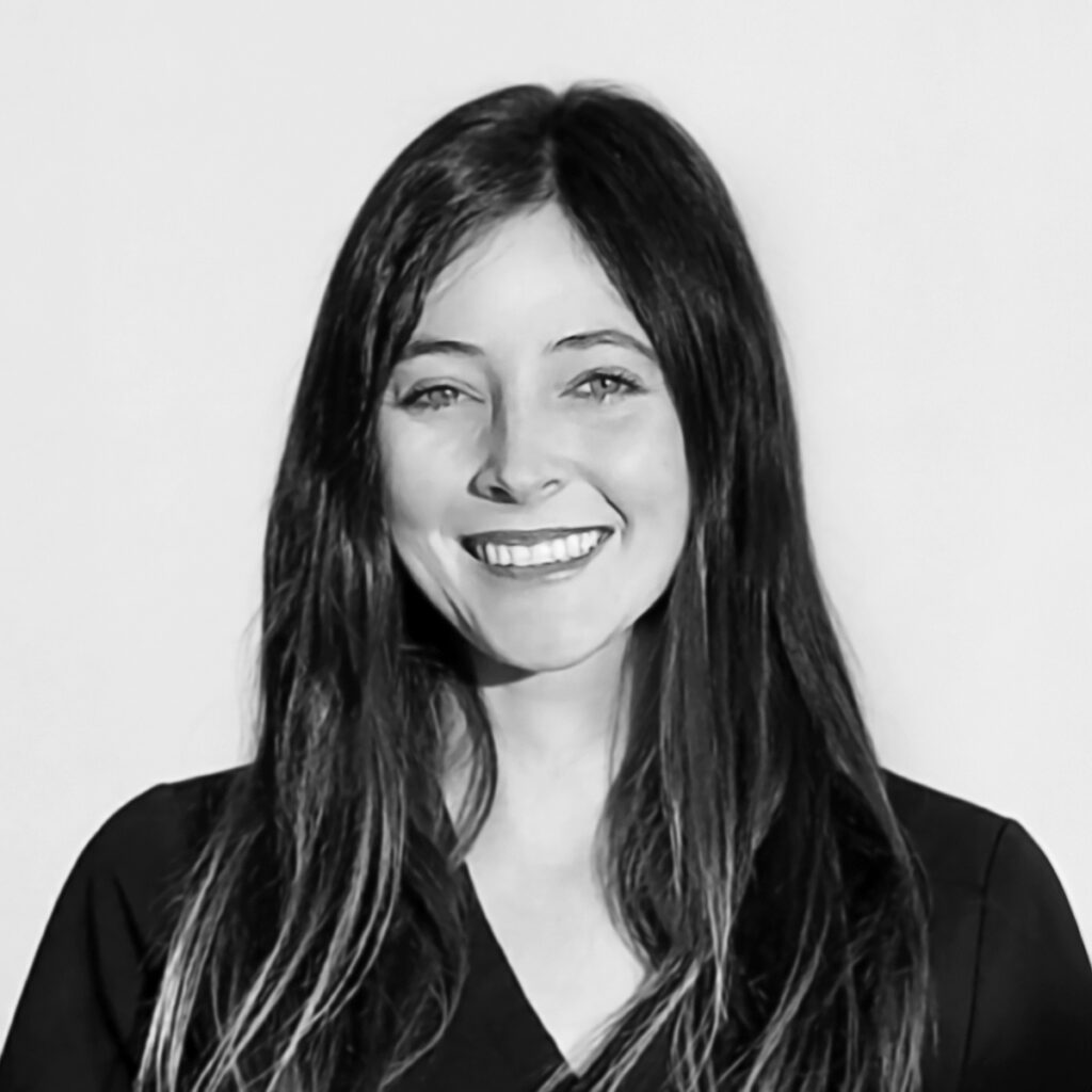 Dr. Brooke Henderson, ND (Naturopathic Doctor) in a studio portrait against a light gray background, wearing a black top.